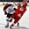 GRAND FORKS, NORTH DAKOTA - APRIL 22: Latvia's Deniss Smirnovs #10 and Denmark's Christoffer Gath #23 battle for position during relegation round action at the 2016 IIHF Ice Hockey U18 World Championship. (Photo by Matt Zambonin/HHOF-IIHF Images)
